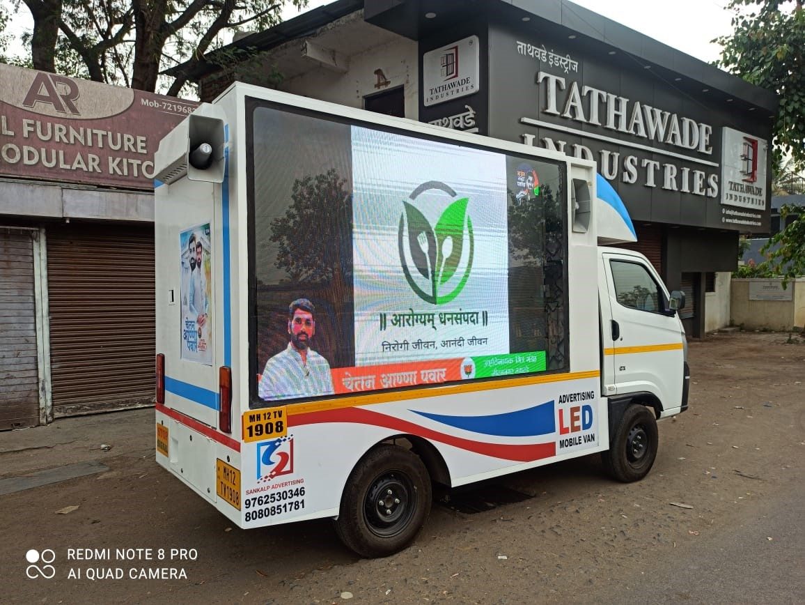 Mobile LED screen van displaying an advertisement on a city street